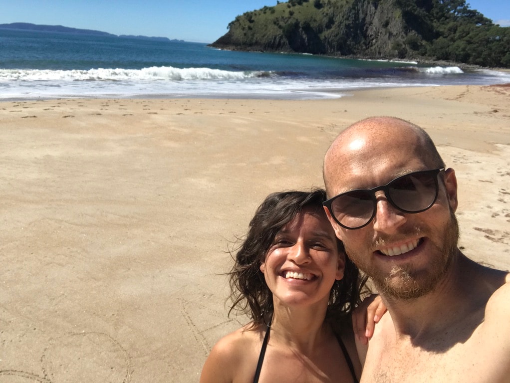 A pear set on a yellow plate upon a soft white canvas texture.